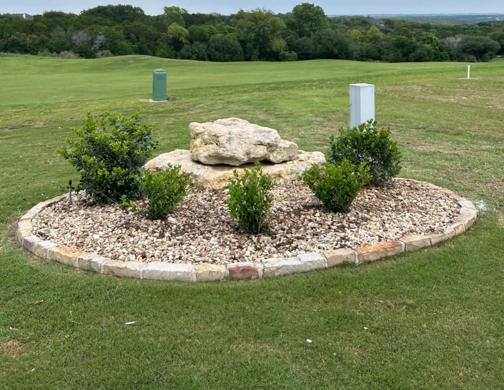 Flower bed renovation with refreshed planting beds and layered landscaping in Burleson, Texas